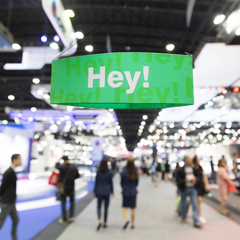 High-visibility curved triangle hanging sign for convention halls