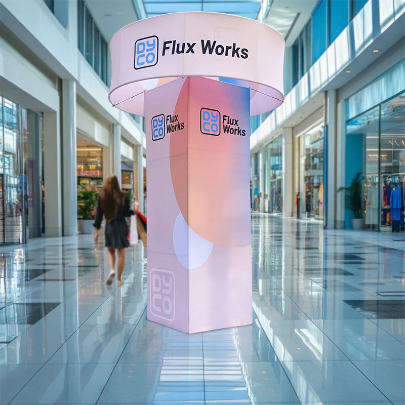 High-visibility square trade show tower with hanging sign