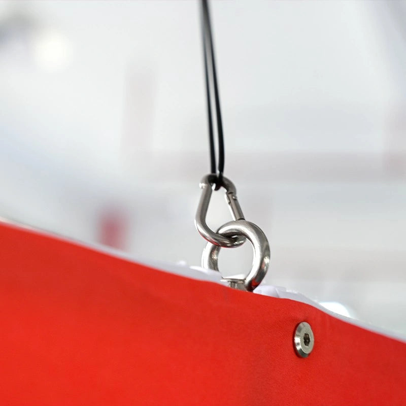 Close-up of graphic print on three-sided pinwheel shaped hanging sign