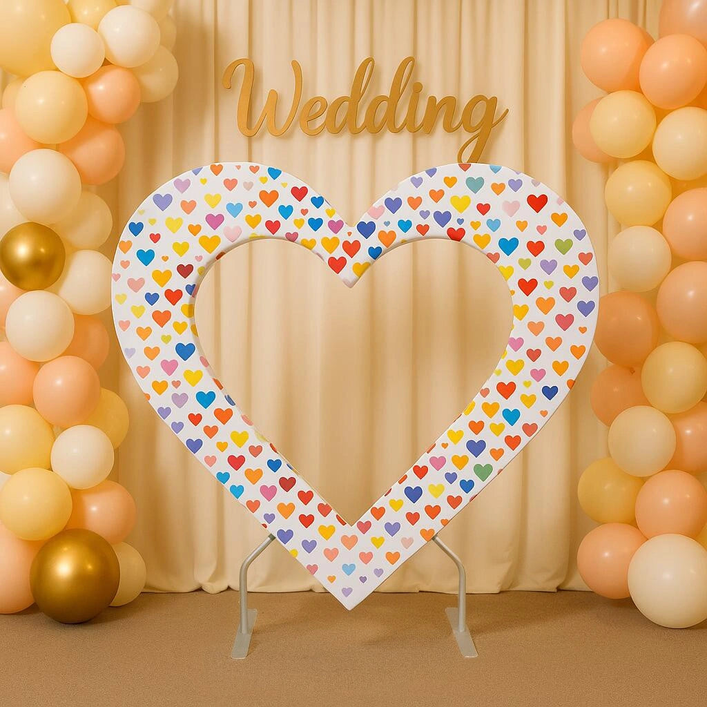 Heart shaped event backdrop with layered design and fabric graphics