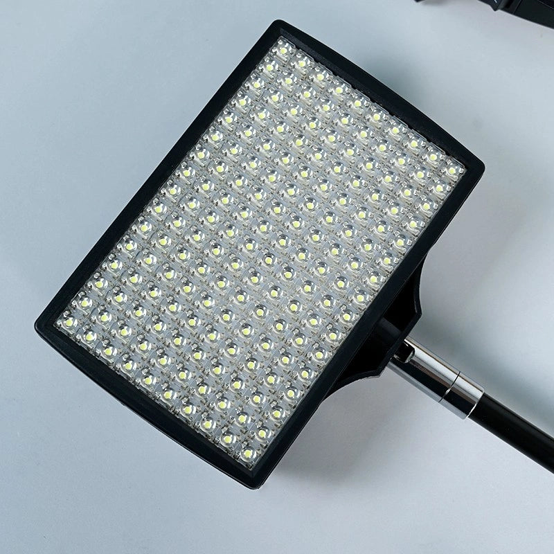 Clip-on LED light for trade show banner stand